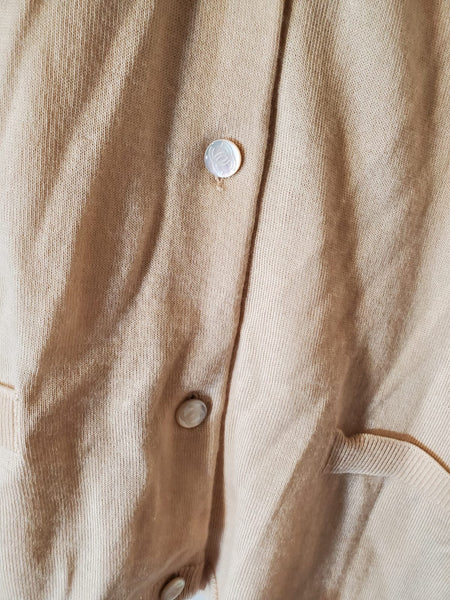 CHANEL Cashmere twinset with CC buttons.