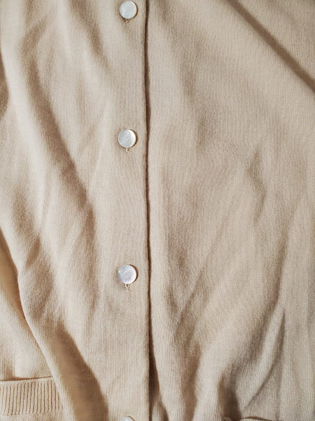 CHANEL Cashmere twinset with CC buttons.